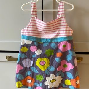 Mini Boden- tank top, striped straps and chest, main tank is flowered.